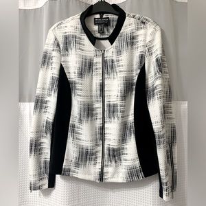 Black and white Size 14 Frank Lyman jacket. Easy to clean polyester fabric.